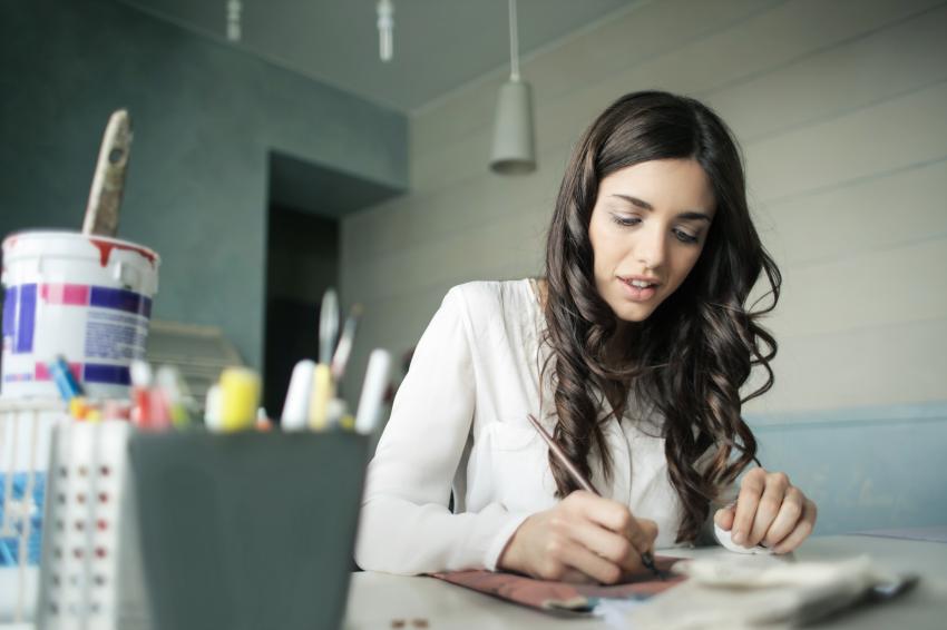 	Photo by bruce mars from Pexels https://www.pexels.com/photo/woman-sitting-while-holding-pen-920377/ 